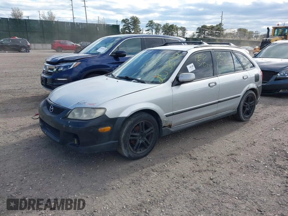 2002 Mazda Protege with VIN JM1BJ245921455563, listed as a IAAI auction lot 42064853 with Not Provided miles and . Bid and sale history available at DreamBid. Image 2.