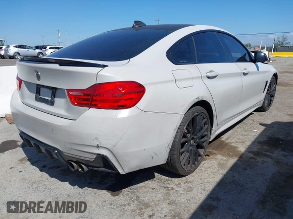 2015 BMW 4 Series 428i xDrive with VIN WBA4C9C54FD330582, listed as a IAAI auction lot 42135691 with 127,289 mi miles and . Bid and sale history available at DreamBid. Image 4.
