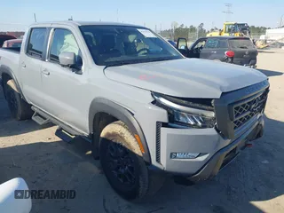 2023 Nissan Frontier Pro-4X z VIN 1N6ED1EK7PN604374, wystawiony jako IAAI lot #41828936 z przebiegiem 60 452 mil mil oraz . Historia ofert i sprzedaży dostępna na DreamBid. Obrazek 1.