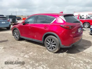 2018 Mazda CX-5 Grand Touring with VIN JM3KFADM7J1357401, listed as a IAAI auction lot 42106012 with 119,420 mi miles and . Bid and sale history available at DreamBid. Image 3.
