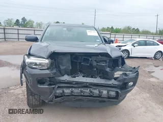 2018 Toyota Tacoma SR5 with VIN 5TFAZ5CN5JX062498, listed as a IAAI auction lot 41867393 with 128,879 mi miles and . Bid and sale history available at DreamBid. Image 13.