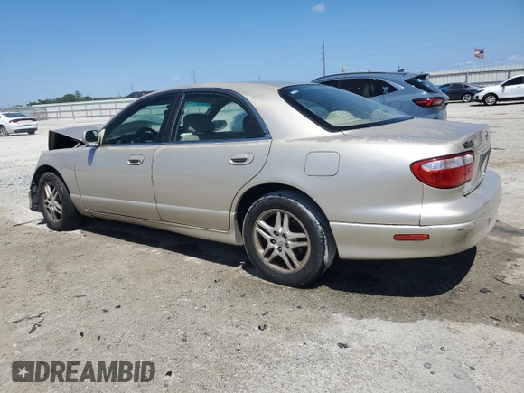 2000 Mazda Millenia with VIN JM1TA2210Y1614967, listed as a Copart auction lot 53606185 with 120,288 mi miles and Salvage Title. Bid and sale history available at DreamBid. Image 2.
