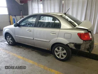 2010 Kia Rio LX with VIN KNADH4A34A6643716, listed as a Copart auction lot 46880375 with 112,265 mi miles and Salvage Title. Bid and sale history available at carsss.com. Image 2.