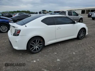 2014 Scion tC z VIN JTKJF5C70E3084411, wystawiony jako Copart lot #54255385 z przebiegiem 152 715 mil mil oraz Szkody całkowita. Historia ofert i sprzedaży dostępna na DreamBid. Obrazek 3.