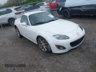 2012 Mazda MX-5 Miata Grand Touring z VIN JM1NC2PF8C0225810, wystawiony jako IAAI lot #41962004 z przebiegiem 32 986 mil mil oraz . Historia ofert i sprzedaży dostępna na DreamBid. Obrazek 1.