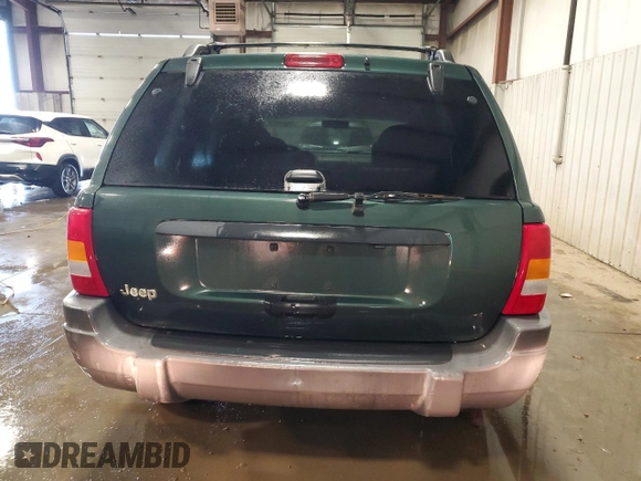 2000 Jeep Grand Cherokee Laredo with VIN 1J4GW48S2YC256123, listed as a Copart auction lot 56015855 with 147,549 mi miles and Salvage title. Bid and sale history available at DreamBid. Image 6.