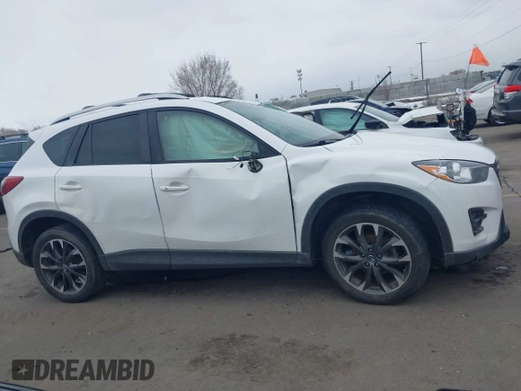 2016 Mazda CX-5 Grand Touring z VIN JM3KE2DY8G0885006, wystawiony jako IAAI lot #41615873 z przebiegiem 118 890 mil mil oraz . Historia ofert i sprzedaży dostępna na DreamBid. Obrazek 13.