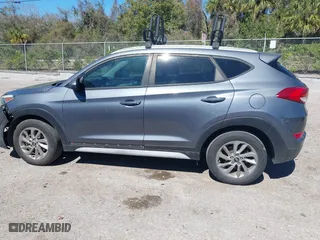 2017 Hyundai Tucson SE Plus with VIN KM8J33A45HU452928, listed as a IAAI auction lot 41601229 with 114,949 mi miles. Bid and sale history available at carsss.com. Image 14.