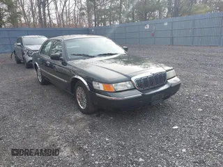 1999 Mercury Grand Marquis GS z VIN 2MEFM74W1XX611123, wystawiony jako IAAI lot #41917606 z przebiegiem 82 619 mil mil oraz . Historia ofert i sprzedaży dostępna na DreamBid. Obrazek 1.