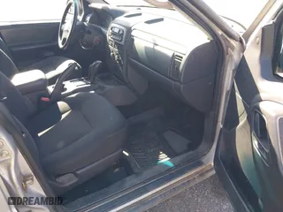 2003 Jeep Grand Cherokee Laredo with VIN 1J4GW48S03C567770, listed as a IAAI auction lot 42028727 with 245,728 mi miles. Bid and sale history available at carsss.com. Image 5.