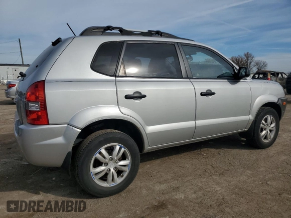 2009 Hyundai Tucson GLS with VIN KM8JM12B79U012399, listed as a Copart auction lot 77663414 with 164,615 mi miles and Salvage Title. Bid and sale history available at carsss.com. Image 3.