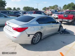 2014 Infiniti Q50 with VIN JN1BV7AP4EM677506, listed as a IAAI auction lot 40113207 with 142,446 mi miles. Bid and sale history available at carsss.com. Image 4.