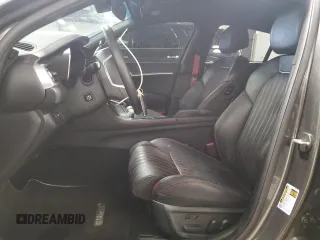 2023 Genesis G70 3.3T with VIN KMTG54TE2PU125150, listed as a Copart auction lot 47024885 with 21,529 mi miles and Salvage Title. Bid and sale history available at carsss.com. Image 7.