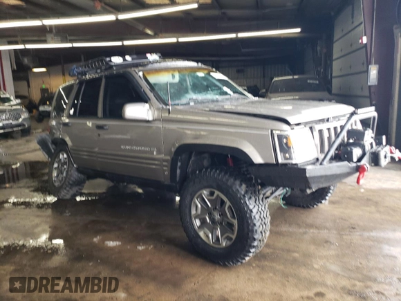 1998 Jeep Grand Cherokee Limited with VIN 1J4GZ78S9WC308708, listed as a Copart auction lot 79315694 with 205,976 mi miles and Salvage title. Bid and sale history available at DreamBid. Image 4.