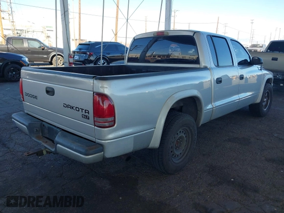 2003 Dodge Dakota SLT with VIN 1D7HL48N13S294573, listed as a IAAI auction lot 41291127 with 227,355 mi miles. Bid and sale history available at carsss.com. Image 4.