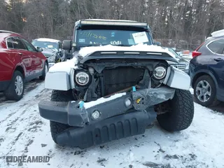 2015 Jeep Wrangler Unlimited Rubicon Hard Rock with VIN 1C4HJWFG1FL659803, listed as a IAAI auction lot 41172485 with 126,881 mi miles. Bid and sale history available at carsss.com. Image 12.