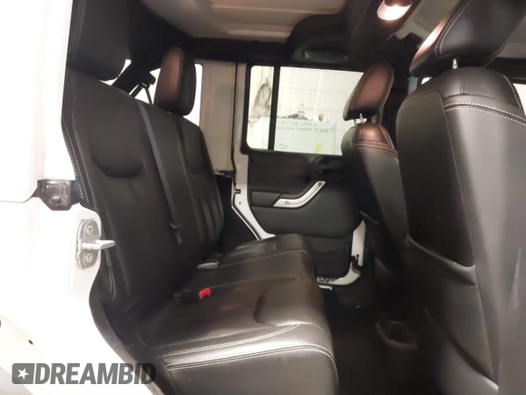 2014 Jeep Wrangler Unlimited Sahara with VIN 1C4BJWEG1EL326605, listed as a IAAI auction lot 41325037 with 135,824 mi miles. Bid and sale history available at carsss.com. Image 8.
