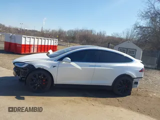2018 Tesla Model X 75D with VIN 5YJXCAE45JF103828, listed as a IAAI auction lot 41698708 with 118,699 mi miles and . Bid and sale history available at carsss.com. Image 13.