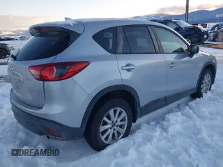 2016 Mazda CX-5 Touring with VIN JM3KE4CY9G0904000, listed as a IAAI auction lot 41186630 with 73,900 mi miles. Bid and sale history available at carsss.com. Image 4.