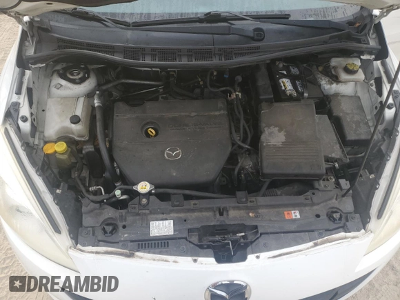 2012 Mazda 5 Sport with VIN JM1CW2BL4C0141205, listed as a Copart auction lot 71437504 with 135,271 mi miles and Salvage Title. Bid and sale history available at DreamBid. Image 11.
