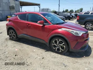 2018 Toyota C-HR XLE with VIN NMTKHMBX7JR011965, listed as a Copart auction lot 56213215 with 147,243 mi miles and Salvage Title. Bid and sale history available at DreamBid. Image 4.