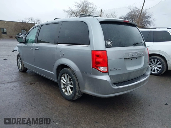 2019 Dodge Grand Caravan SXT with VIN 2C4RDGCG1KR580039, listed as a IAAI auction lot 41997472 with 163,915 mi miles and . Bid and sale history available at DreamBid. Image 3.
