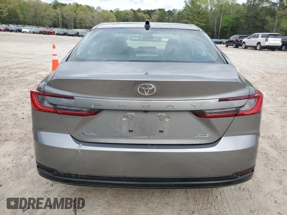 2025 Toyota Camry LE with VIN 4T1DAACKXSU556874, listed as a Copart auction lot 52694525 with 7,076 mi miles and Salvage Title. Bid and sale history available at carsss.com. Image 6.
