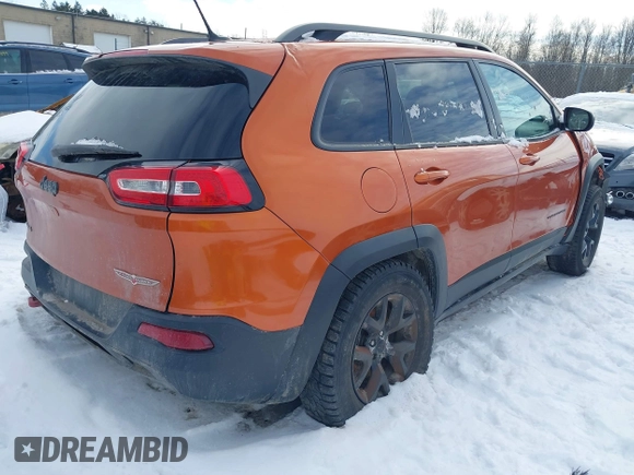 2015 Jeep Cherokee Trailhawk with VIN 1C4PJMBS9FW655233, listed as a IAAI auction lot 41430715 with 138,181 mi miles and . Bid and sale history available at carsss.com. Image 4.