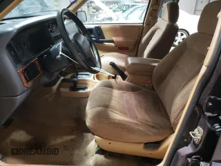 1997 Jeep Grand Cherokee Laredo with VIN 1J4GZ58S6VC573007, listed as a Copart auction lot 42728355 with 164,269 mi miles and Salvage Title. Bid and sale history available at carsss.com. Image 7.