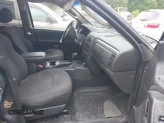 2004 Jeep Grand Cherokee Laredo z VIN 1J4GW48S64C152101, wystawiony jako IAAI lot #42165988 z przebiegiem 244 247 mil mil oraz . Historia ofert i sprzedaży dostępna na DreamBid. Obrazek 5.