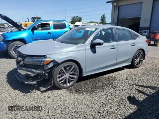 2022 Honda Civic Touring with VIN 2HGFE1F90NH319961, listed as a Copart auction lot 57799335 with 36,458 mi miles and Salvage title. Bid and sale history available at DreamBid. Image 1.