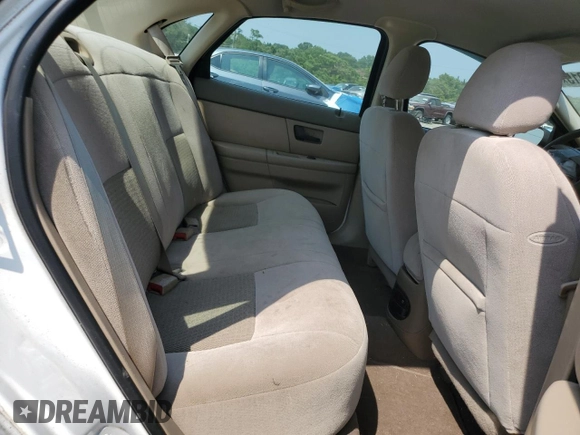 2005 Ford Taurus SE z VIN 1FAHP53U65A184099, wystawiony jako Copart lot #60960015 z przebiegiem Nie podano mil oraz Szkoda całkowita • Salvage title. Historia ofert i sprzedaży dostępna na DreamBid. Obrazek 10.