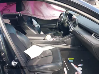 2022 Kia K5 GT-Line z VIN 5XXG64J2XNG095158, wystawiony jako IAAI lot #42163963 z przebiegiem 59 756 mil mil oraz . Historia ofert i sprzedaży dostępna na DreamBid. Obrazek 5.