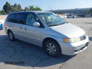 2004 Honda Odyssey EX-RES z VIN 5FNRL18864B149213, wystawiony jako IAAI lot #42227096 z przebiegiem 182 145 mil mil oraz . Historia ofert i sprzedaży dostępna na DreamBid. Obrazek 1.
