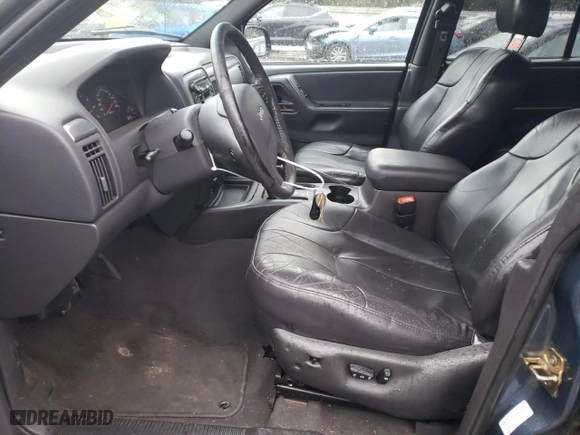 2001 Jeep Grand Cherokee Laredo with VIN 1J4GW48N91C560288, listed as a Copart auction lot 87030774 with 157,544 mi miles and Salvage Title. Bid and sale history available at carsss.com. Image 7.