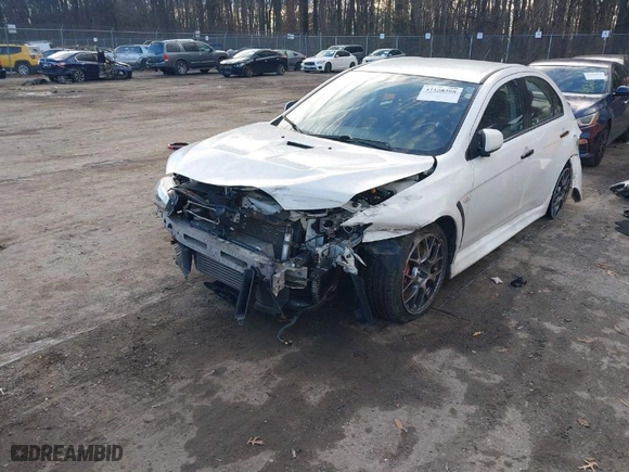 2014 Mitsubishi Lancer Evolution MR with VIN JA32W5FV5EU017592, listed as a IAAI auction lot 41158408 with 97614 miles. Bid and sale history available at carsss.com. Image 2.