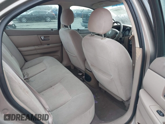 2003 Mercury Sable GS z VIN 1MEFM50U33A606937, wystawiony jako IAAI lot #41058899 z przebiegiem 138 479 mil mil oraz . Historia ofert i sprzedaży dostępna na DreamBid. Obrazek 8.