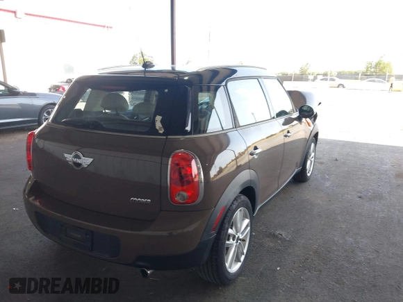 2012 MINI Countryman with VIN WMWZB3C51CWM04563, listed as a IAAI auction lot 42564564 with 95,760 mi miles and . Bid and sale history available at DreamBid. Image 4.