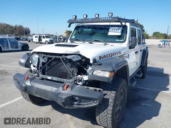 2022 Jeep Gladiator Mojave z VIN 1C6JJTEG0NL103523, wystawiony jako IAAI lot #41842011 z przebiegiem 36 160 mil mil oraz . Historia ofert i sprzedaży dostępna na DreamBid. Obrazek 19.