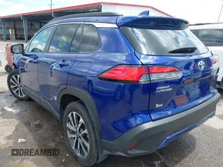 2023 Toyota Corolla Cross XLE with VIN 7MUEAAAG7PV065106, listed as a IAAI auction lot 42168195 with 6,519 mi miles and . Bid and sale history available at DreamBid. Image 3.