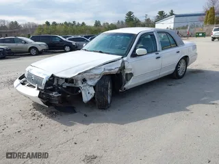 2010 Mercury Grand Marquis LS with VIN 2MEBM7FV7AX611959, listed as a IAAI auction lot 41980176 with 112,885 mi miles. Bid and sale history available at carsss.com. Image 2.