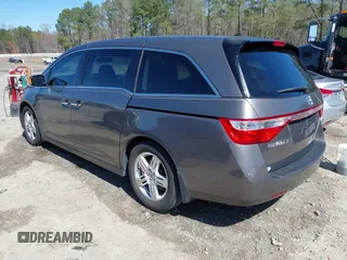 2012 Honda Odyssey Touring with VIN 5FNRL5H91CB057344, listed as a IAAI auction lot 41835272 with 158,854 mi miles. Bid and sale history available at carsss.com. Image 3.