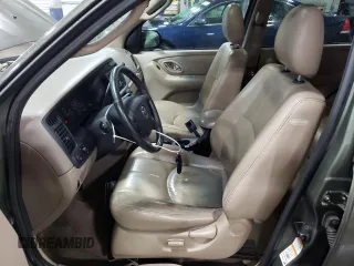 2002 Mazda Tribute LX with VIN 4F2CU08192KM29966, listed as a Copart auction lot 79458124 with 186,406 mi miles and Salvage Title. Bid and sale history available at carsss.com. Image 7.