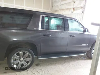 2015 GMC Yukon XL SLT with VIN 1GKS2HKC6FR667110, listed as a IAAI auction lot 41472250 with 141,383 mi miles. Bid and sale history available at carsss.com. Image 13.