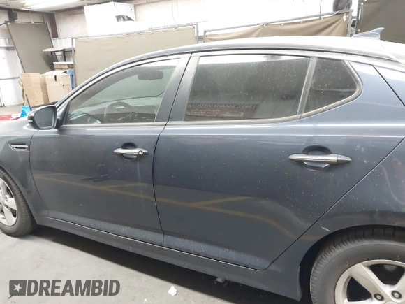 2015 Kia Optima LX z VIN KNAGM4A78F5594402, wystawiony jako IAAI lot #42232732 z przebiegiem 83 363 mil mil oraz . Historia ofert i sprzedaży dostępna na DreamBid. Obrazek 14.