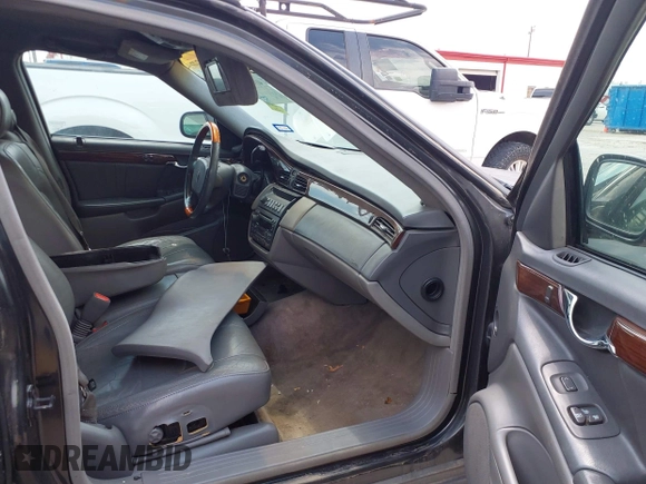 2001 Cadillac DeVille DHS z VIN 1G6KE57YX1U190955, wystawiony jako IAAI lot #41941668 z przebiegiem 191 040 mil mil oraz . Historia ofert i sprzedaży dostępna na DreamBid. Obrazek 5.