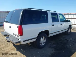 1999 Chevrolet Suburban with VIN 3GNFK16R4XG227995, listed as a IAAI auction lot 42034142 with 241,792 mi miles. Bid and sale history available at carsss.com. Image 4.