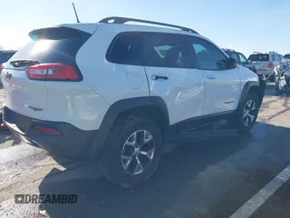 2018 Jeep Cherokee Trailhawk with VIN 1C4PJMBX7JD550173, listed as a IAAI auction lot 41094306 with 74,128 mi miles. Bid and sale history available at carsss.com. Image 4.