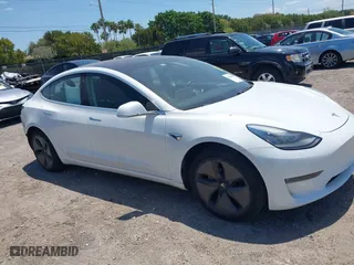 2018 Tesla Model 3 Long Range Battery with VIN 5YJ3E1EAXJF027179, listed as a IAAI auction lot 42059918 with 43,566 mi miles. Bid and sale history available at carsss.com. Image 1.