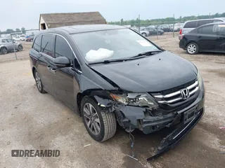 2015 Honda Odyssey Touring Elite with VIN 5FNRL5H97FB124565, listed as a IAAI auction lot 42358412 with 206,444 mi miles and . Bid and sale history available at DreamBid. Image 1.